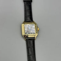 Gold, white dial, black leather